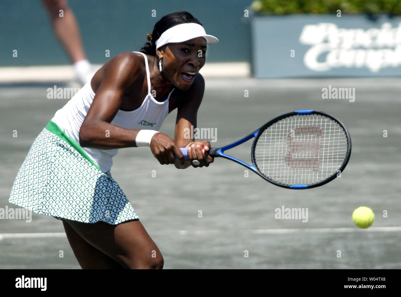 Venus Williams hits a return on her way to defeating Conchita Martinez 2-6, 6-2, 6-1 to win the Family Circle Cup championship on Sunday, April, 18, 2004 in Charleston, S.C. (UPI Photo/Nell Redmond) Stock Photo