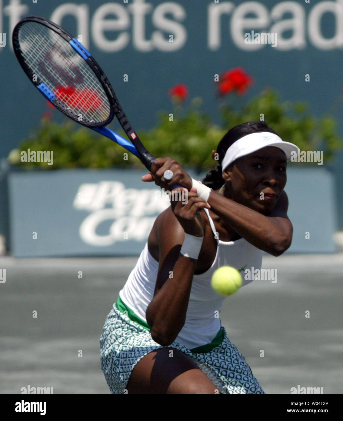 Venus Williams hits a return on her way to defeating Conchita Martinez 2-6, 6-2, 6-1 to win the Family Circle Cup championship on Sunday, April, 18, 2004 in Charleston, S.C. (UPI Photo/Nell Redmond) Stock Photo
