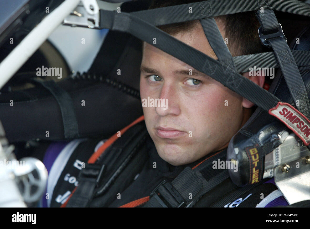 Race car driver Ryan Newman sits in his car on pit road as he awaits