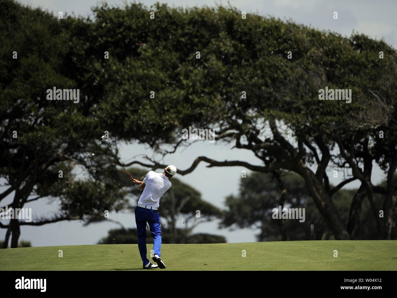 Marcel Siem of Germany uses a fairway wood on his stroke near trees at hole two during the third round of the PGA Championship on August 11, 2012 at the Ocean Course in Kiawah Island, South, Carolina.  UPI/David Tulis Stock Photo
