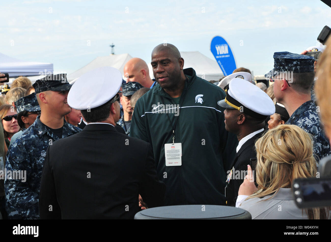 Magic Johnson greets service members attending the inaugural Quicken Loans Carrier Classic basketball game Friday, November 11, 2011 on the flight deck of the aircraft carrier USS Carl Vinson (CVN 70) in San Diego, California.   Michigan State University and the University of North Carolina tipped off the  Carrier Classic, which is a celebration of Veterans Day.   UPI/James R. Evans/Navy Stock Photo