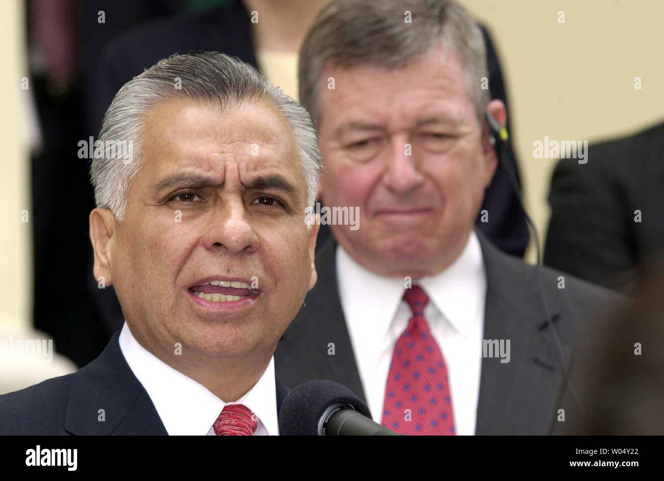 SDP2003070807- SAN DIEGO, July 8 (UPI) - US Attorney General John Ashcroft (background) along with Rafael Macedo De la Concha, the Attorney General of Mexico (speaking) announced July 8 2003 at a news conference in San Diego, California, the indictment of 12 individuals who represent the hierarchy of the Arellano-Felix drug cartel. The Arellano-Felix organization is the most notorious multi-national drug trafficking organization ever and is responsible for multiple murders and the transportation of cocaine and marijuana from Tijuana, Mexico to the US through the San Diego and Mexicali borders. Stock Photo