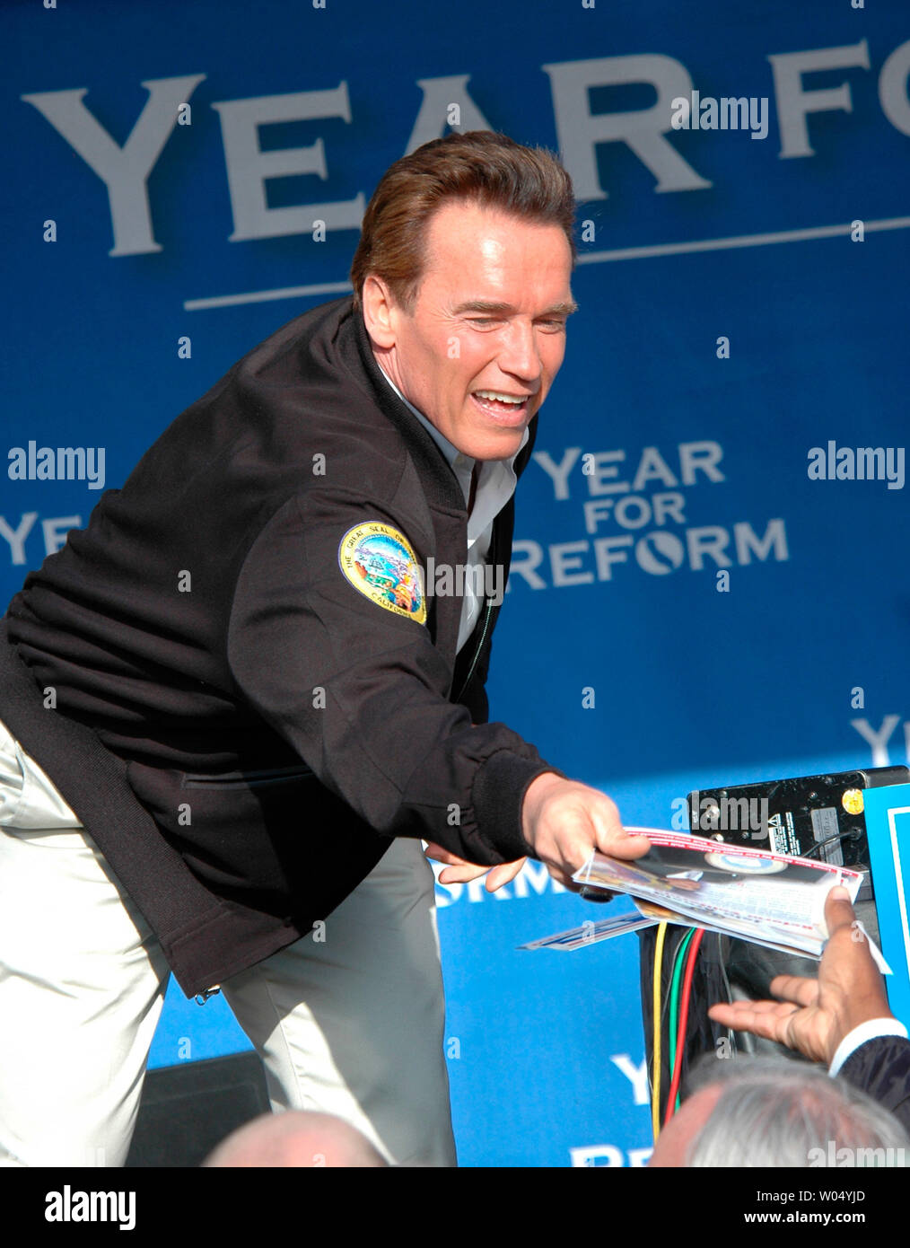 California Governor Arnold Schwarzenegger hands out petitions to place