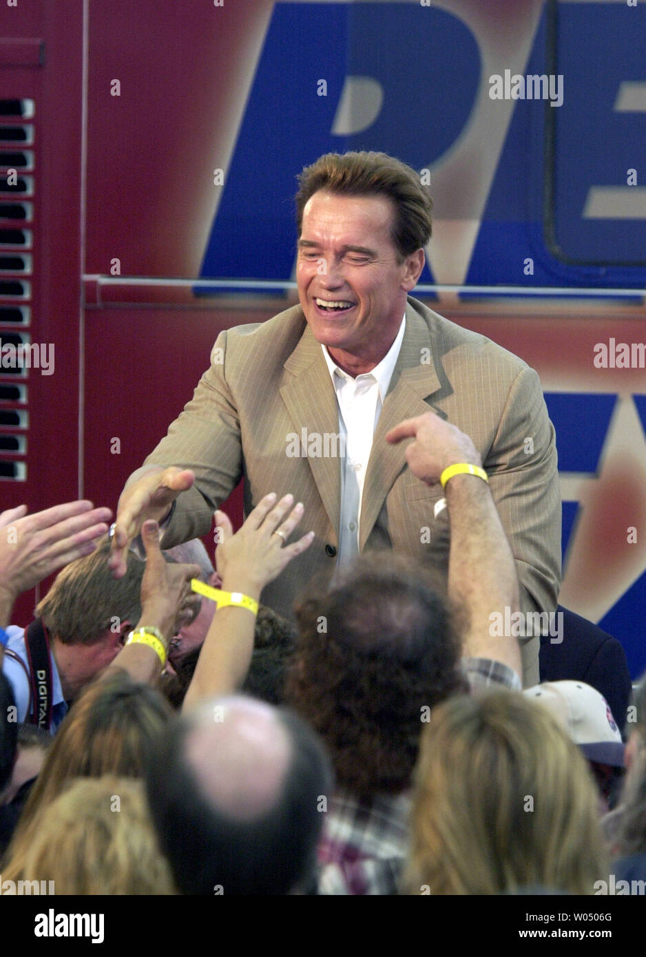 California Governor. Arnold Schwarzenegger greets supporters in front of his campaign bus in San Diego, California in which he will tour southern California November 5, 2005. Actors Warren Beatty and Annette Bening were on hand to protest his reform propositions that go to the voters November. 8, 2005. (UPI Photo/Earl S. Cryer) Stock Photo