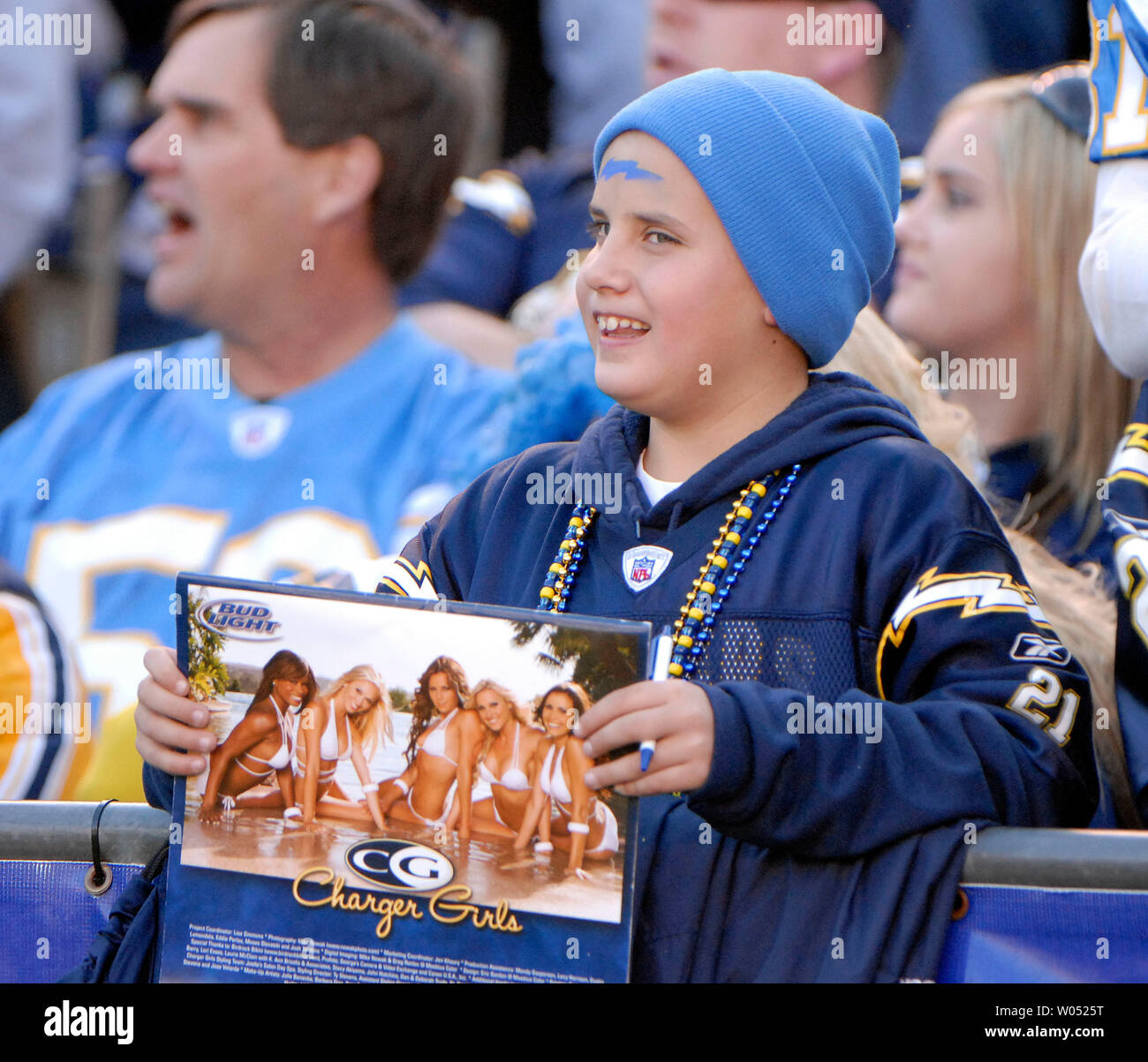 A young San Diego Charger fan tries to get autographs from Chargers cheerleaders during the Chargers win over the Arizona Cardinals at Qualcomm Stadium in San Diego on December 31, 2006. (UPI Photo/Earl S. Cryer) Stock Photo