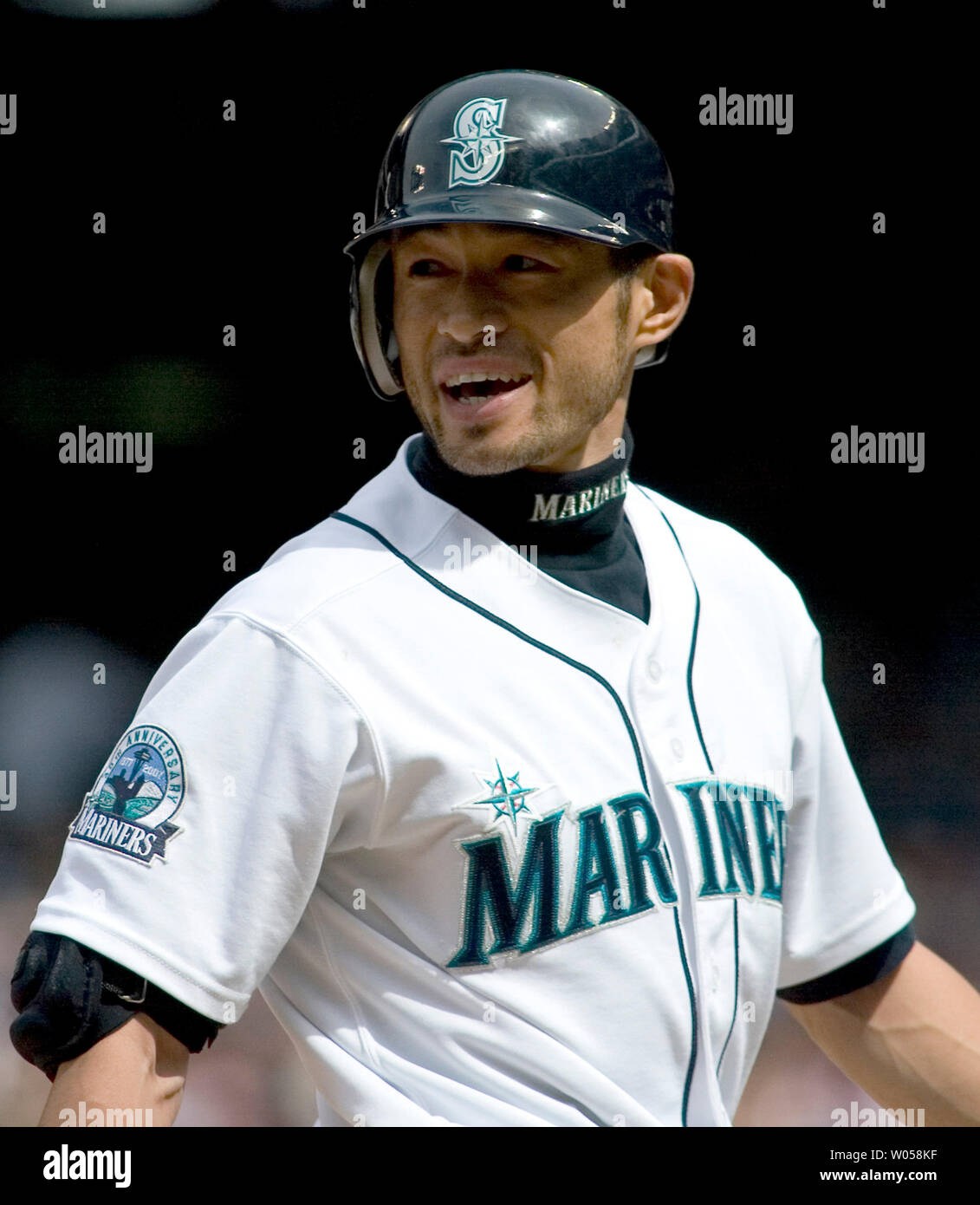 Seattle Mariners' Ichiro Suzuki of Japan has a couple of words for home  plate umpire Brian Knight after he was called out looking at a third strike  against the Boston Red Sox