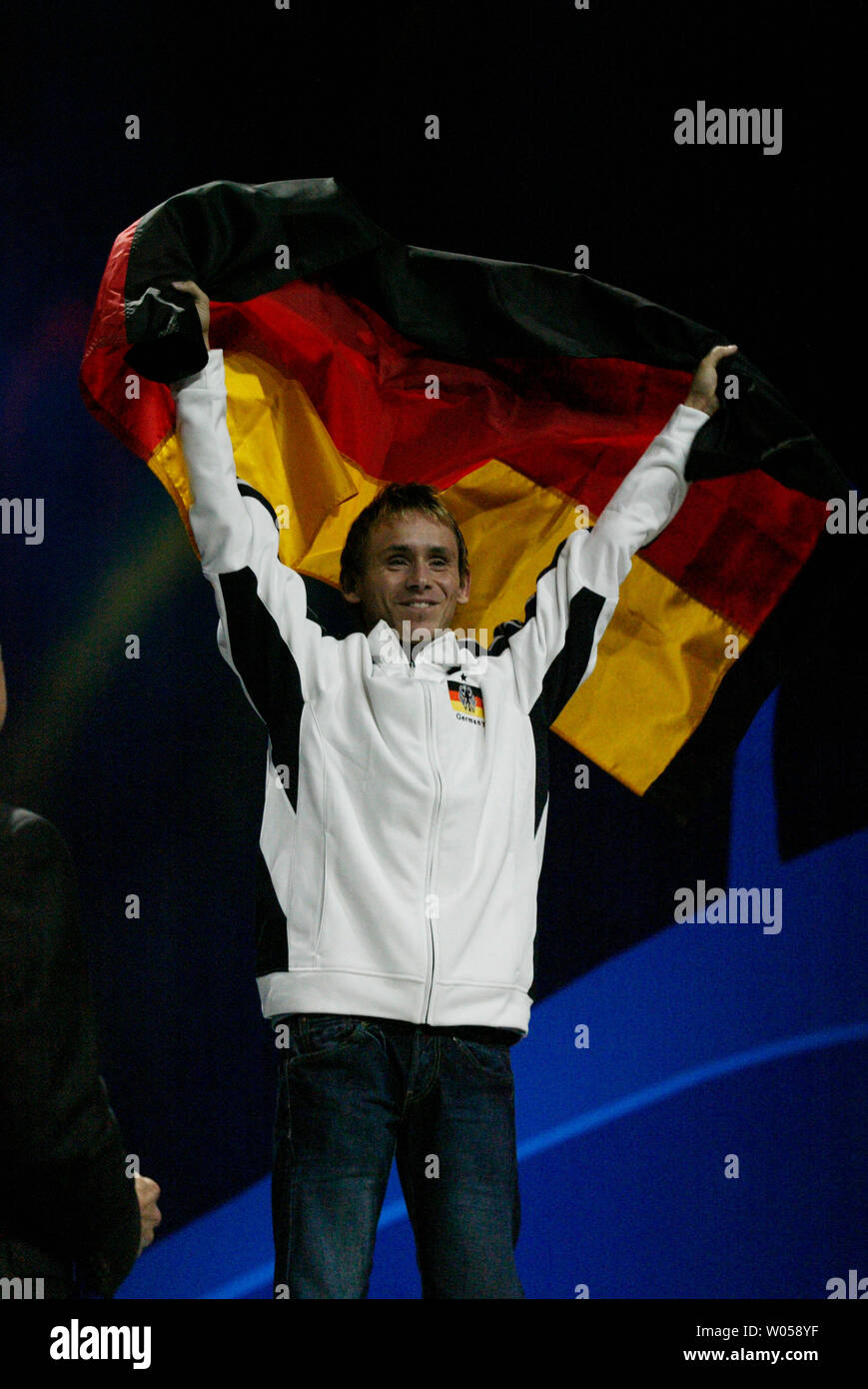 FIFA Soccer 07 Gold Medal winer Daniel Schellhase, of Germany, waves the German flag during the World Cyber Games 2007 Closing Ceremonies held in Seattle on October 7, 2007. Over 700 players from 74 countries participated in the four day grand finals for medals, prizes and 00,000. (UPI Photo/Jim Bryant). Stock Photo