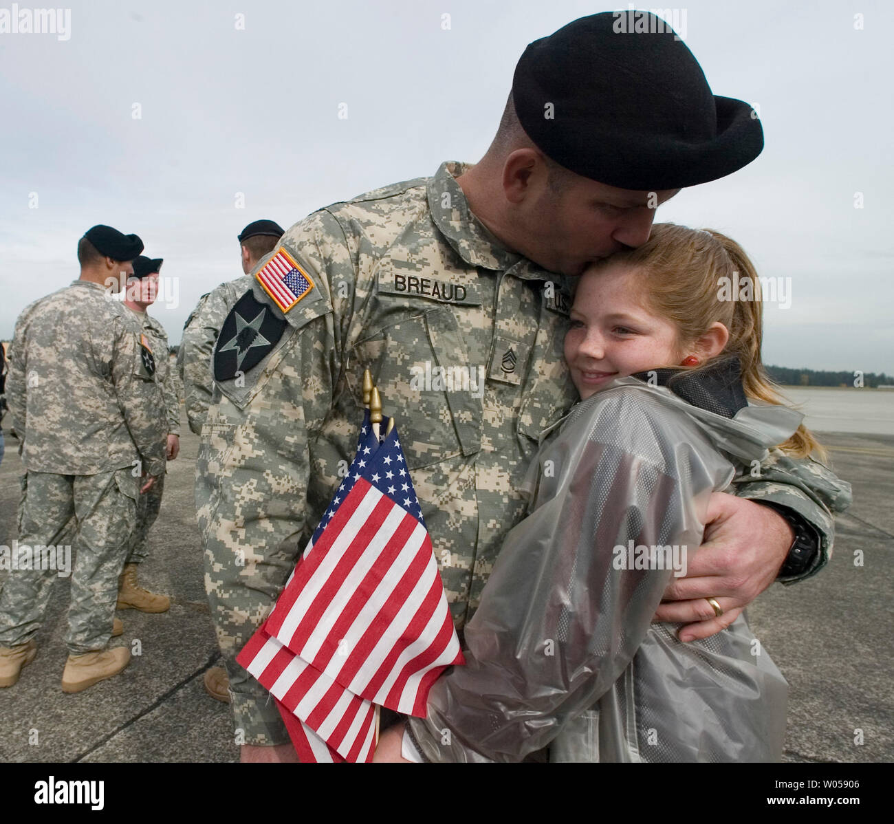 Sgt. 1st Class Wade Breaud hugs his 10-year-old daughter Emily after ...