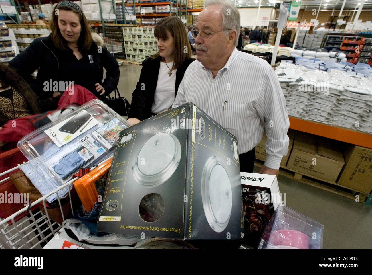 Costco co-founder Jim Sinegal greets customers at the grand opening of store in Gig Harbor, WA., on November 2, 2007.  (UPI Photo/Jim Bryant) Stock Photo