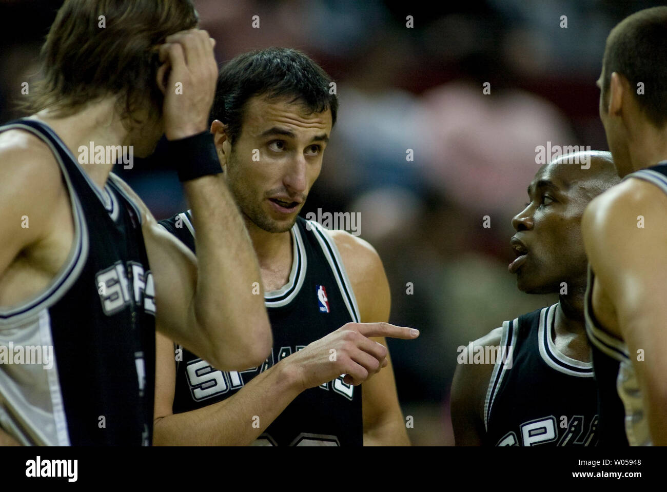 San Antonio Spurs' Manu Ginobili, of Argentina, (C) talks to teammates Ime Udoka (L), Jacque Vaughn (R) and Brent Barry during a timeout against the  Seattle Supersonics' in the first half at the Key Arena in Seattle on November 25, 2007. (UPI Photo/Jim Bryant). Stock Photo