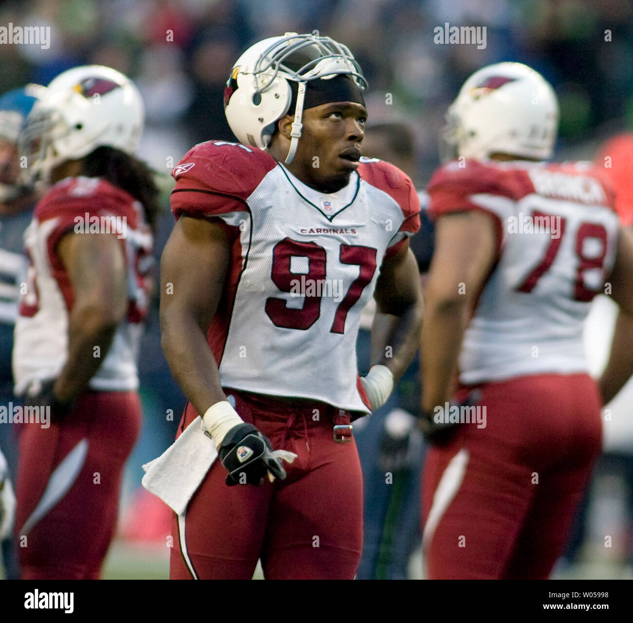 Frustrated Arizona Cardinals' linebacker Calvin Pave watches the replay  screen after teammate Darnell Dockett was given an unsportsman like  pentalty against the Seattle Seahawks in the second half at Qwest Field in