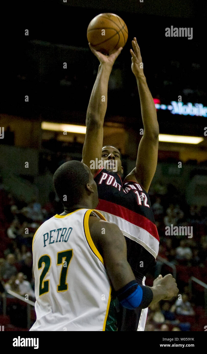 Portland Trail Blazers Lamarcus Aldridge R Hits A Jump Shot Over Defending Seattle Supersonics Johan Petro Of France During The First Half At The Key Arena In Seattle On March 24 2008