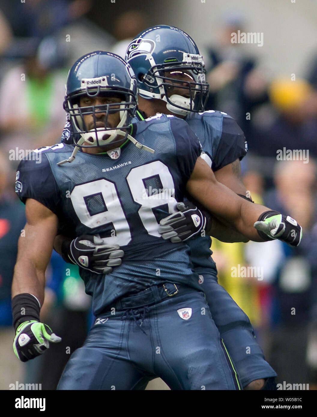 Seattle Seahawks' linebacker Julian Peterson (C) talks with