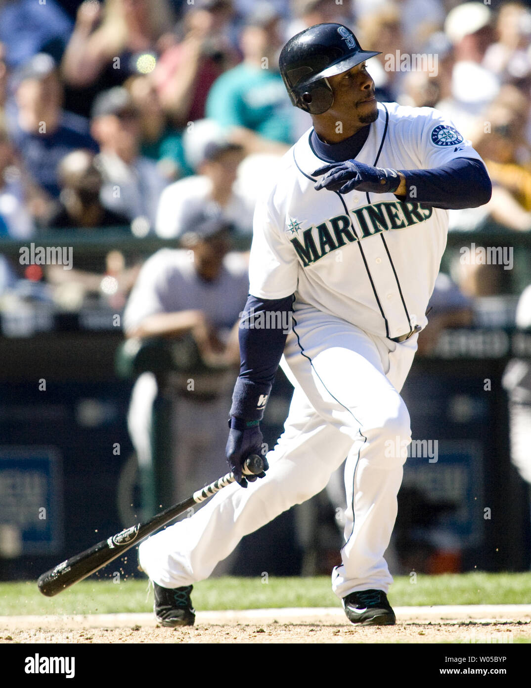 Seattle Mariners' Ken Griffey Jr. watches his single to center