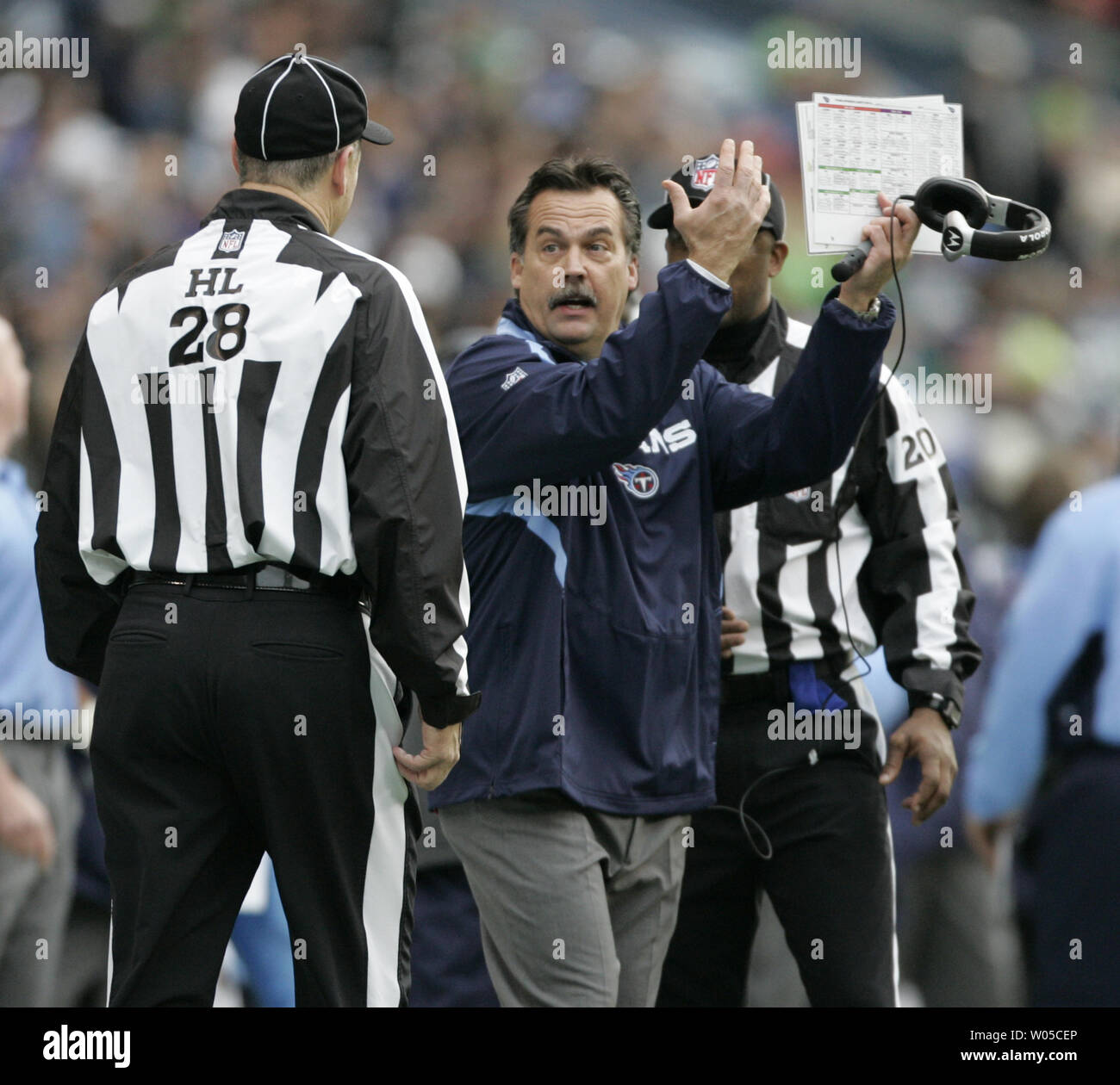 Tennessee Titans Head Coach Jeff Fisher (C) argues a penalty to head linesman Mark Hittner against his team in the second period against the Seattle Seahawks at Qwest Field in Seattle on January 3, 2010. The Titans beat the Seahawks 17-13.  UPI /Jim Bryant Stock Photo