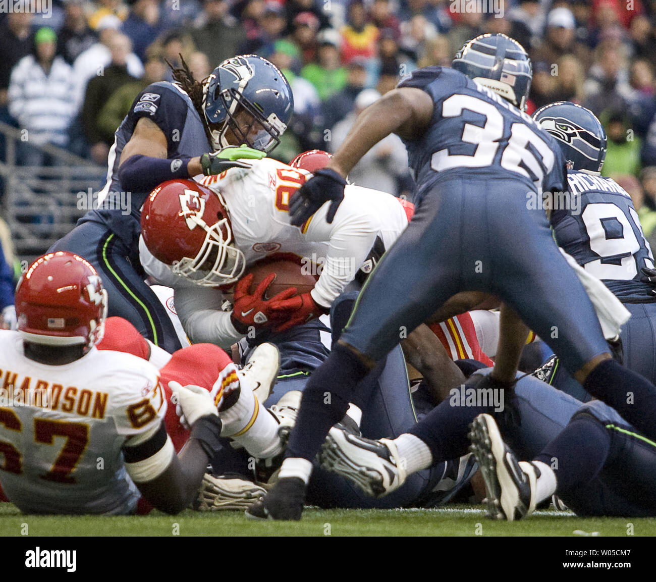 Seattle Seahawks defensive tackle Tony McDaniel (99) bats down a