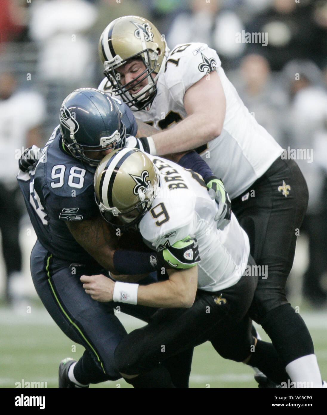 New Orleans Saints' quarterback Drew Brees is sacked by Seattle Seahawks defensive end Cameron Morrah in the second quarter of the NFC's wild-card playoff game on Saturday January 8, 2011 at Qwest Field in Seattle.      (UPI /Jim Bryant) Stock Photo