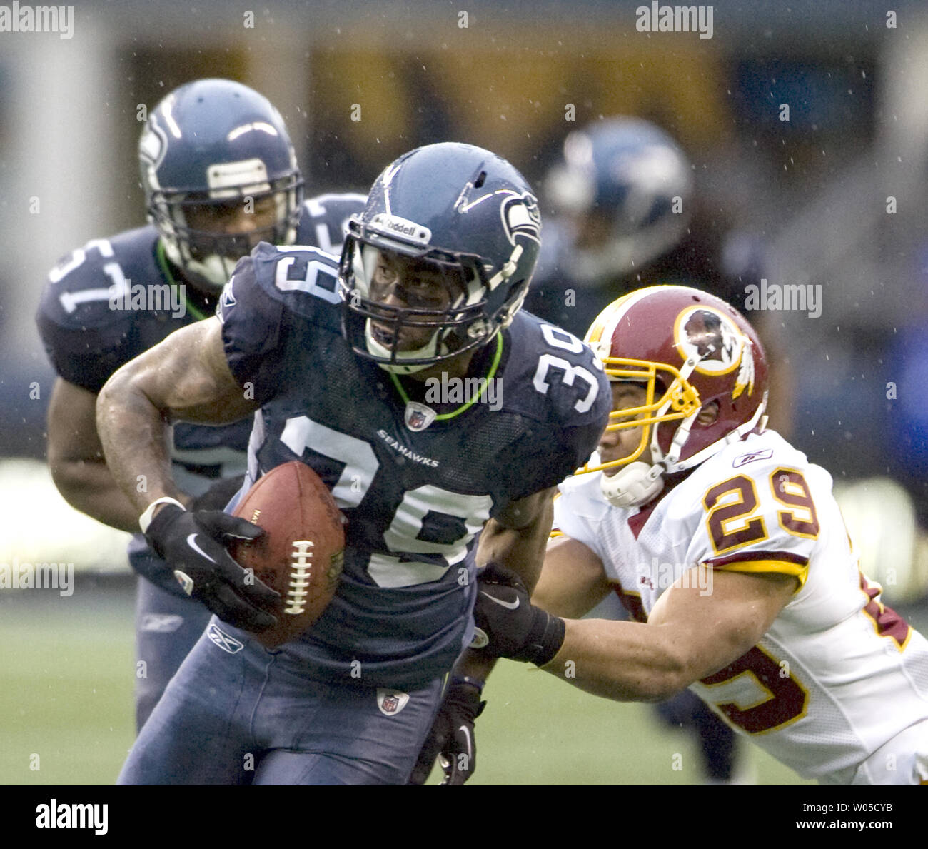 Washington Redskins linebacker Ryan Kerrigan (91) scores a touchdown  against the Atlanta Falcons in the first quarter at FedEx Field in  Landover, Maryland on Sunday, October 7, 2012. Redskin defenders DeAngelo  Hall (