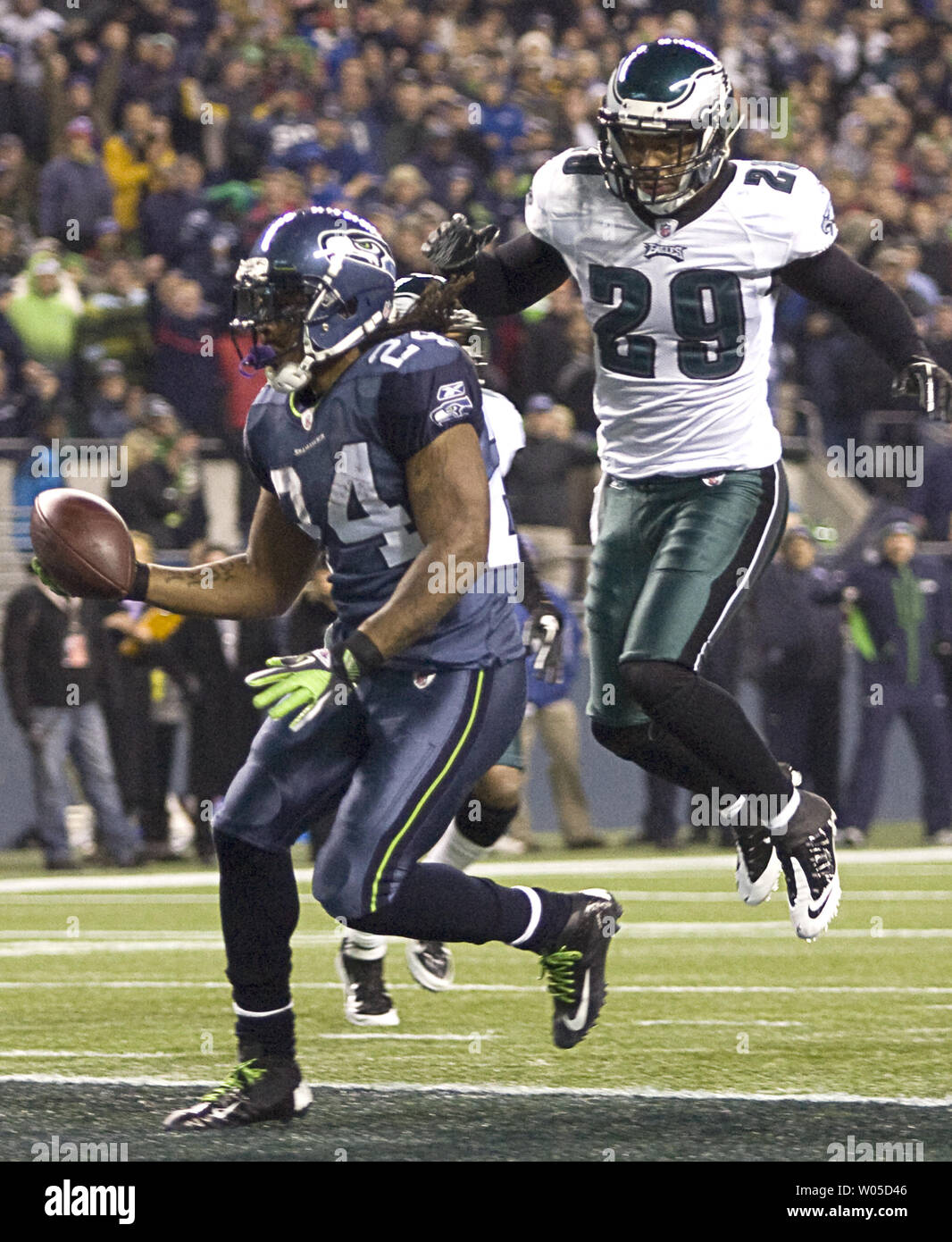Seattle Seahawks running back Marshawn Lynch runs past Philadelphia Eagles free safety Earl Thomas for a first quarter touchdown at CenturyLink Field in Seattle, Washington on December 1, 2011. The Seahawks beat the Eagles 31-14.  UPI/Jim Bryant Stock Photo
