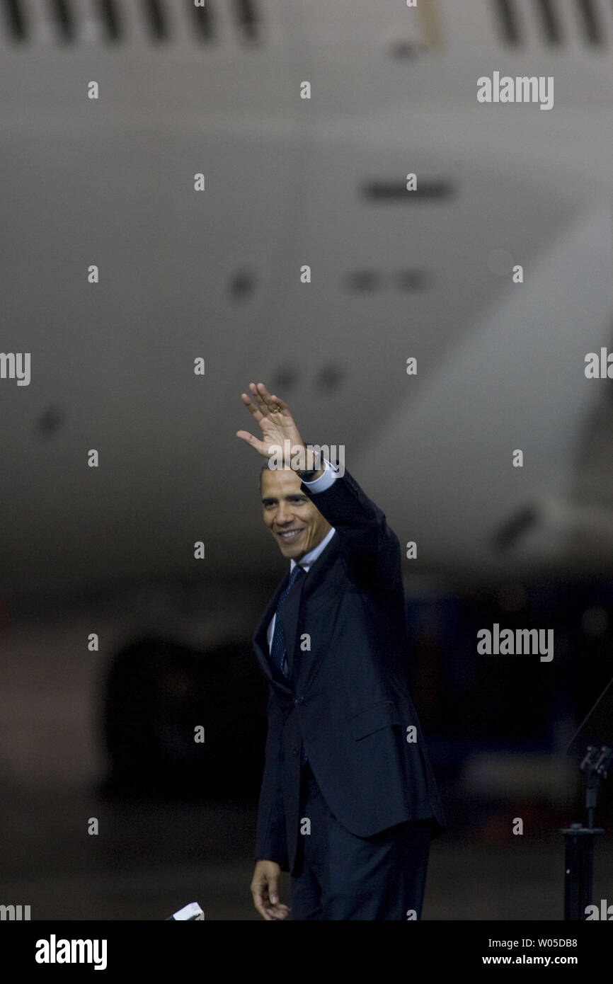 President Barack Obama waves to Boeing employees after speaking about his blueprint for an economy built to last, based on American domestic manufacturing and promoting American exports,  at the aerospace giant's assembly facility in Everett, Washington on February 17, 2012. Later Obama will be attending two fund raising events for his re-election campaign.   UPI/Jim Bryant Stock Photo