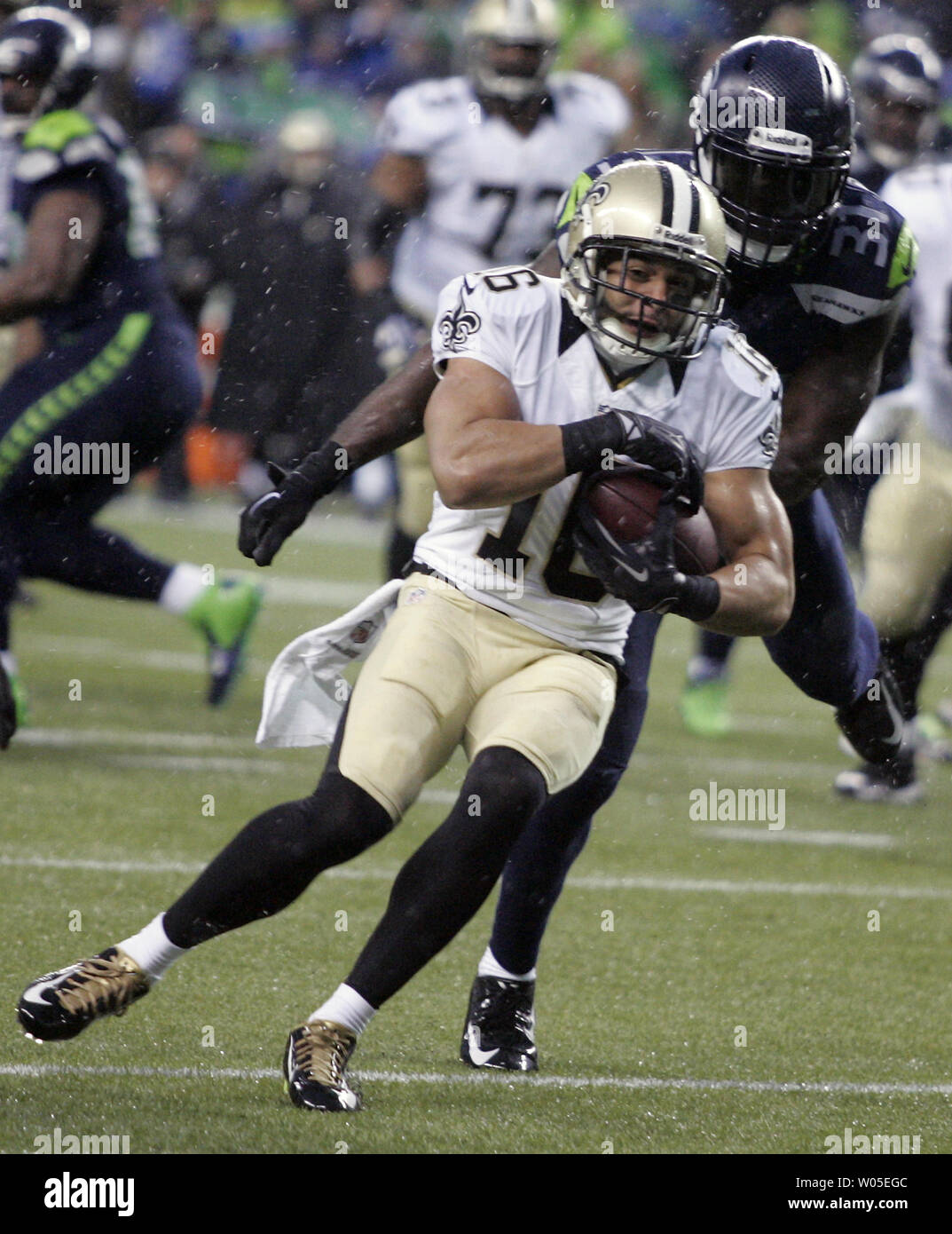 Seattle Seahawks strong safety Kam Chancellor (31) collides with Seattle  Seahawks free safety Earl Thomas (29) during a near interception while  covering Carolina Panthers tight end Greg Olsen (88) at CenturyLink Field