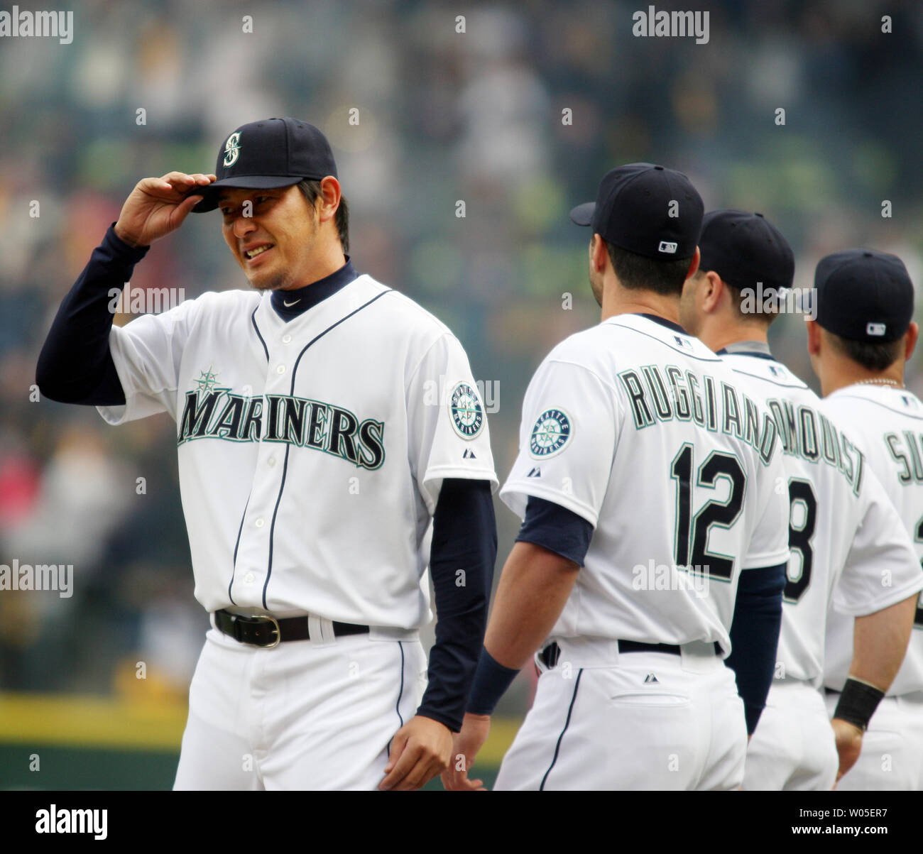 Seattle Mariners' pitcher Iwakuma Hisashi, of Japan, touches his hat after being introduced before playing the Los Angeles Angels in the season home opener April 6, 2015 at Safeco Field in Seattle.  The Mariners beat the Angels 4-1.    Photo by Jim Bryant/UPI Stock Photo