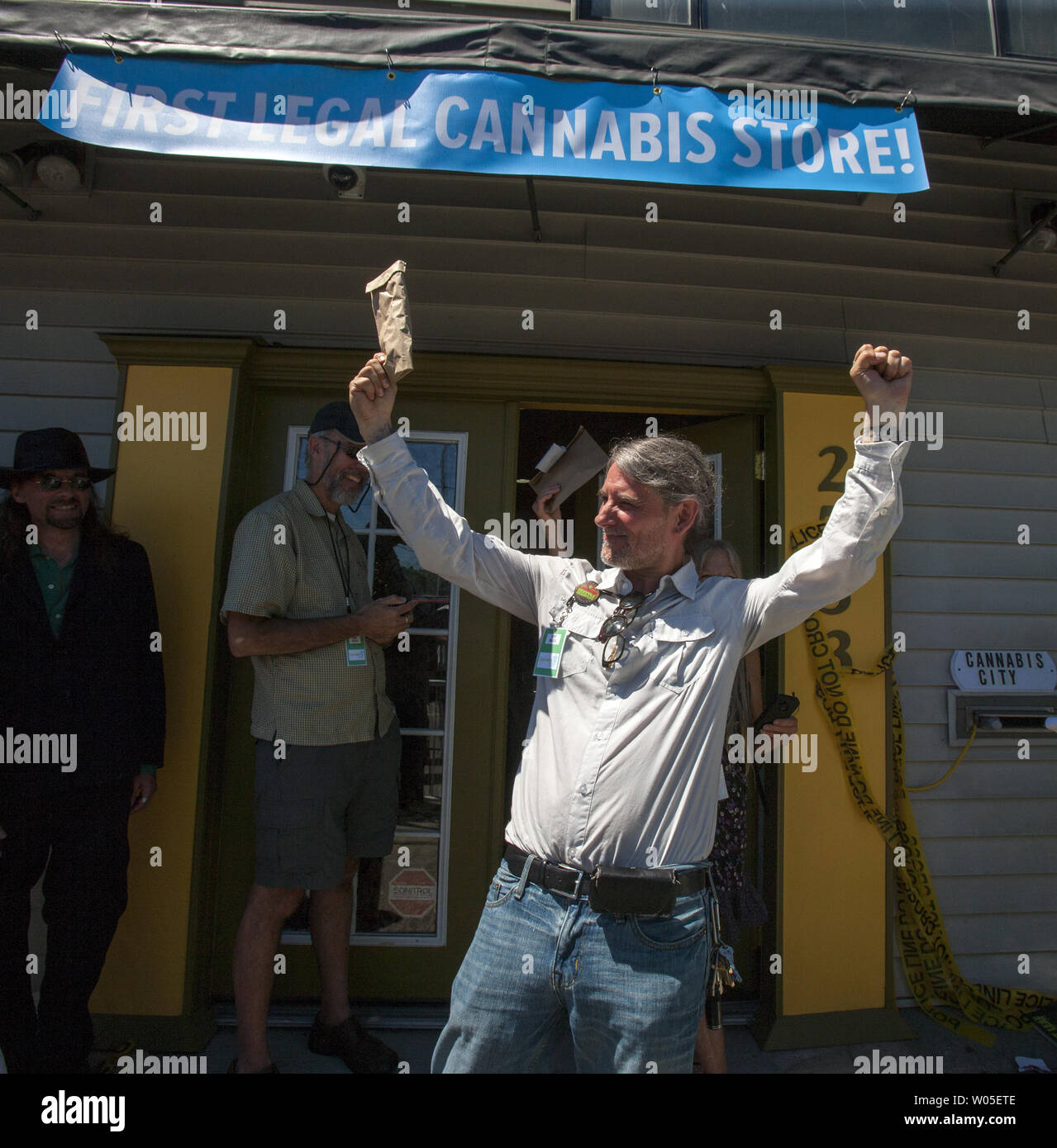 Steve McPeak, Seattle's Hemp Fest organizer, holds up his bag of marijunana purchased in Cabannis City, WashingtonÕs first recreational marijuana stores that open July, 8, 2014 in Seattle.  Owner James Lathrop expects to sell all 10 pounds of pot at $15 to $20 per gram. Lathrop and his business manager had been working as many as 16 hours a day to prepare the business for its first customers. He said Cannabis City passed its two-hour state inspection last week.  UPI/Jim Bryant ...................................................................................................................... Stock Photo