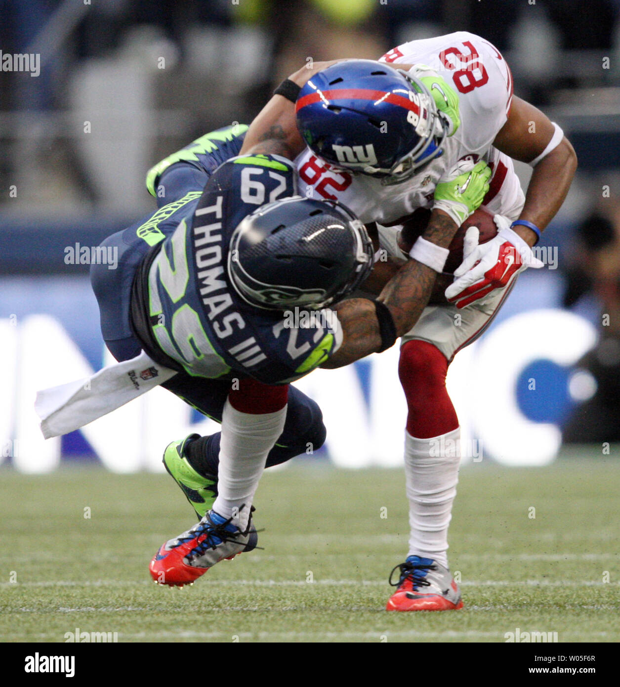 Seattle Seahawks  free safety Earl Thomas (29) tackles New York Giants wide receiver Rueben Randle (82) at CenturyLink Field in Seattle, Washington on November 9, 2014. The Seahawks  beat the Giants 38-17.     UPI/Jim Bryant Stock Photo
