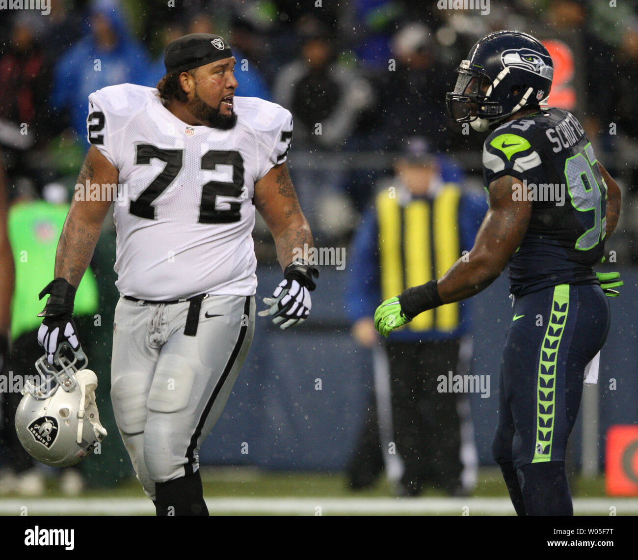 Seattle Seahawks defensive end O'Brien Schofield (93) and Oakland Raiders  tackle Donald Penn (72) has words with one another during the fourth  quarter at CenturyLink Field in Seattle, Washington on November 2,