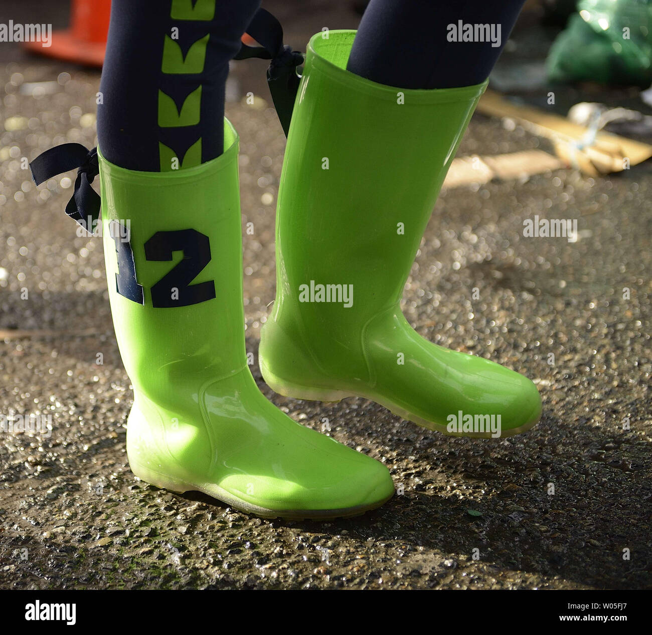 A Seattle Seahawks fan shows off her 12th Man boots before the start of a  game against the Green Bay Packers in the NFC Championship game at  CenturyLink Field in Seattle, Washington