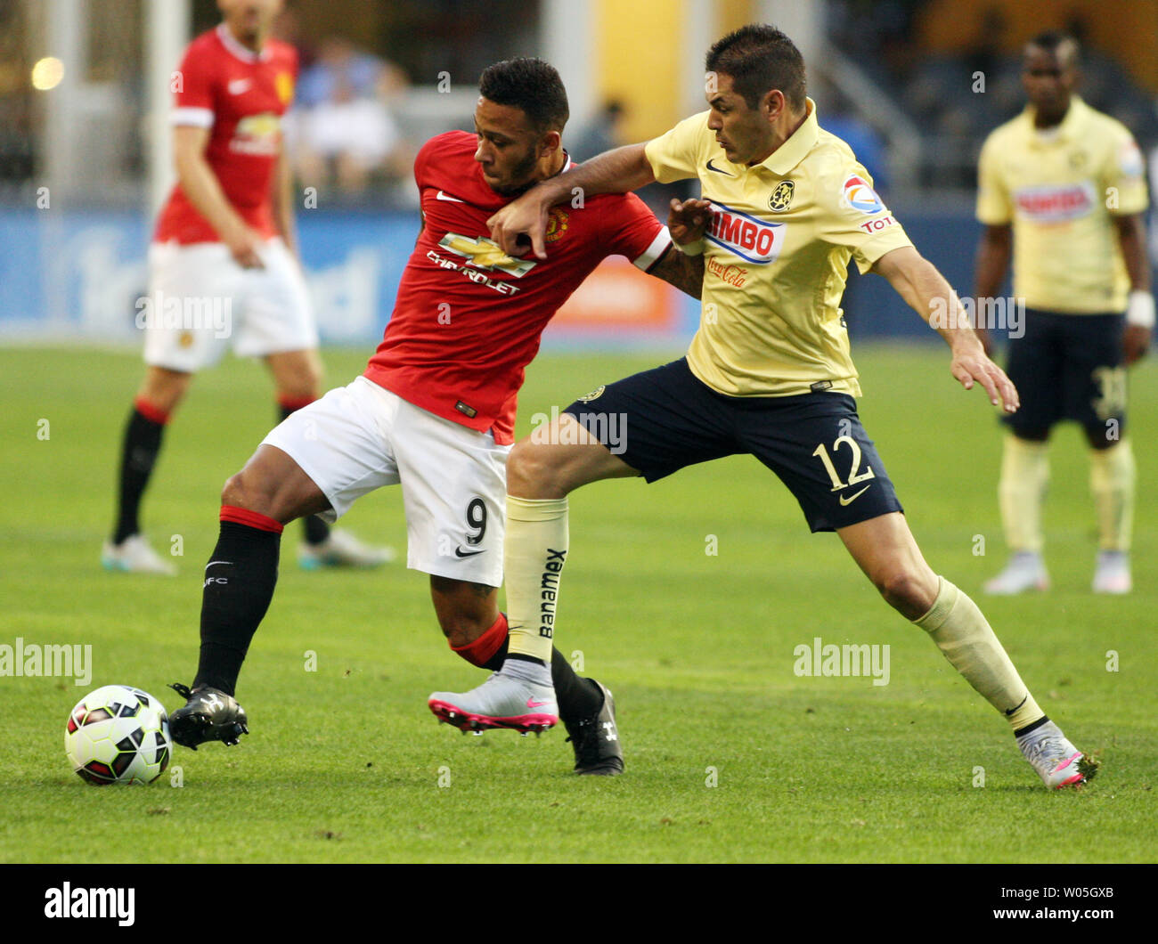 Manchester United's Memphis Depay (9) controls the ball against  Club America's Pablo Cesar Aguilar (12)  in the 2015 International Champions Cup match on July 17, 2015 in Seattle, Washington.  Manchester United beat Club America 1-0. Photo by Jim Bryant/UPI Stock Photo