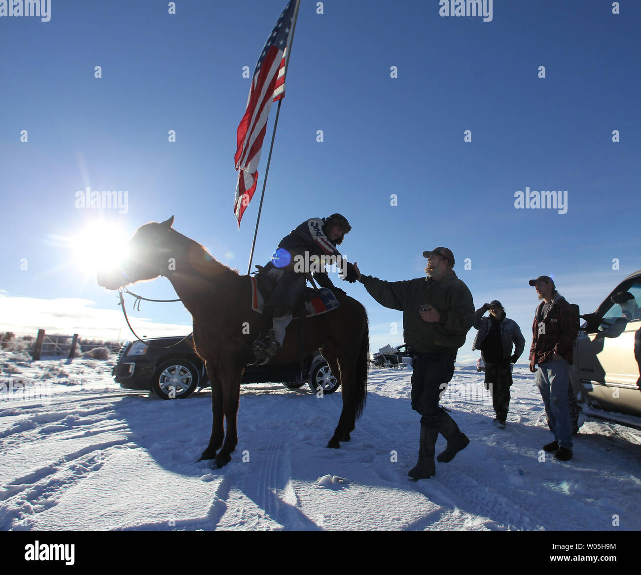 Duane Ehmer, of Irrigon, Oregon, left, greets Brad Williams, who joined the armed activists at the Malheur National Wildlife Reserve on January 15, 2016 in Burns, Oregon. Ehmer has been pulling sentry duty during the takeover. Ammon Bundy and about 20 other protesters took over the refuge on Jan. 2 after a rally to support the imprisoned local ranchers Dwight Hammond Jr., and his son, Steven Hammond.      Photo by Jim Bryant/UPI Stock Photo