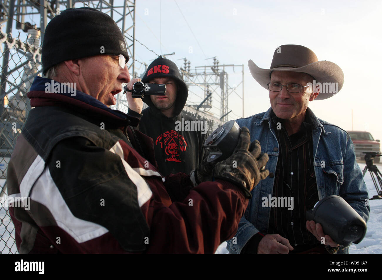 Activists Stuart Wellingham, left,  reads off the ISBM numbers to one of two FBI surveillance cameras found at a power station near the Malheur National Wildlife Reserve on January 15, 2016 in Burns, Oregon.  Ammon Bundy and about 20 other protesters took over the refuge on Jan. 2 after a rally to support the imprisoned local ranchers Dwight Hammond Jr., and his son, Steven Hammond. Another surveillance camera was found near the reserve.    Photo by Jim Bryant/UPI Stock Photo