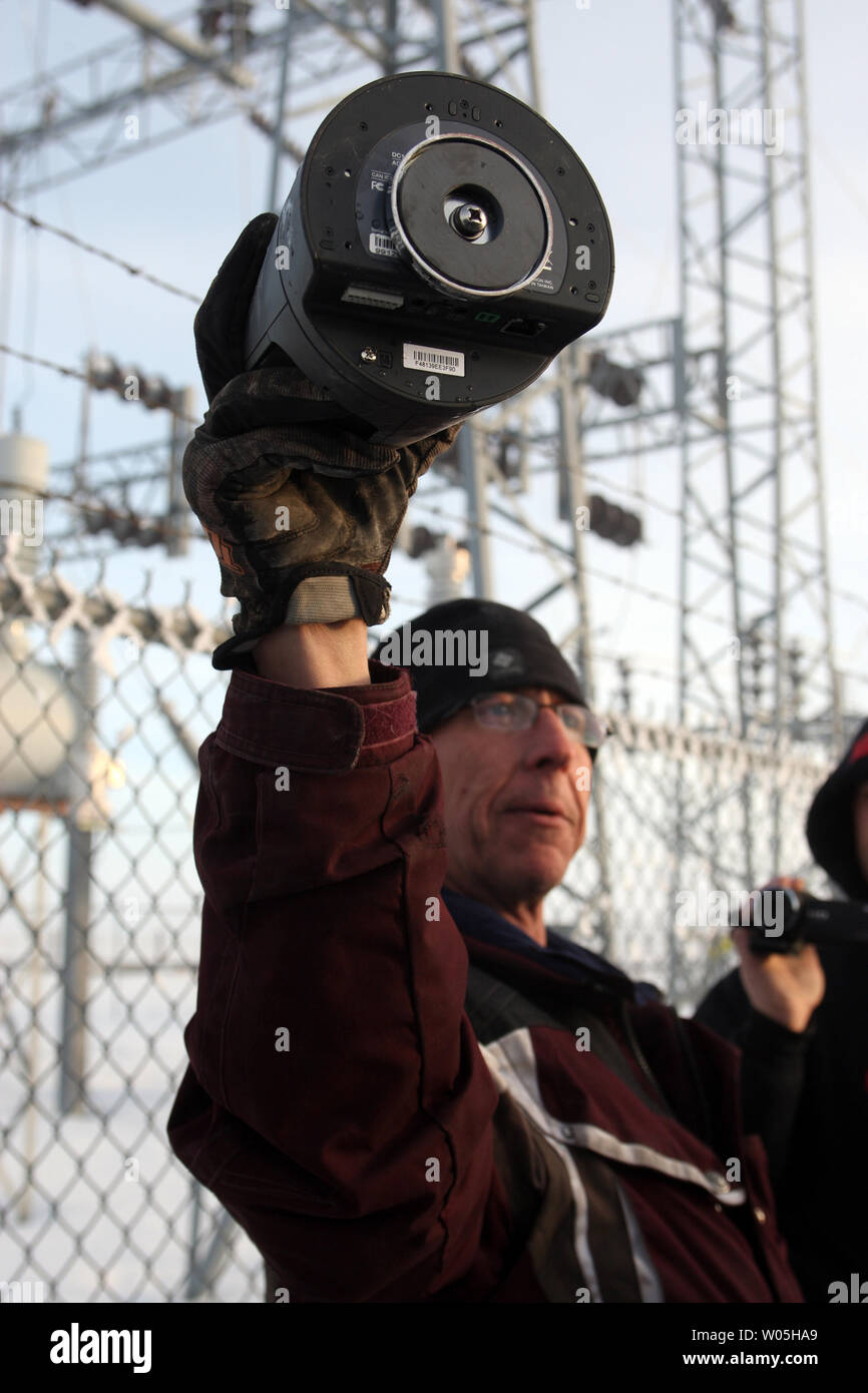 Activists Stuart Wellingham holds one of two FBI surveillance cameras found at a power station near the Malheur National Wildlife Reserve on January 15, 2016 in Burns, Oregon.  Ammon Bundy and about 20 other protesters took over the refuge on Jan. 2 after a rally to support the imprisoned local ranchers Dwight Hammond Jr., and his son, Steven Hammond. Another surveillance camera was found near the reserve.    Photo by Jim Bryant/UPI Stock Photo