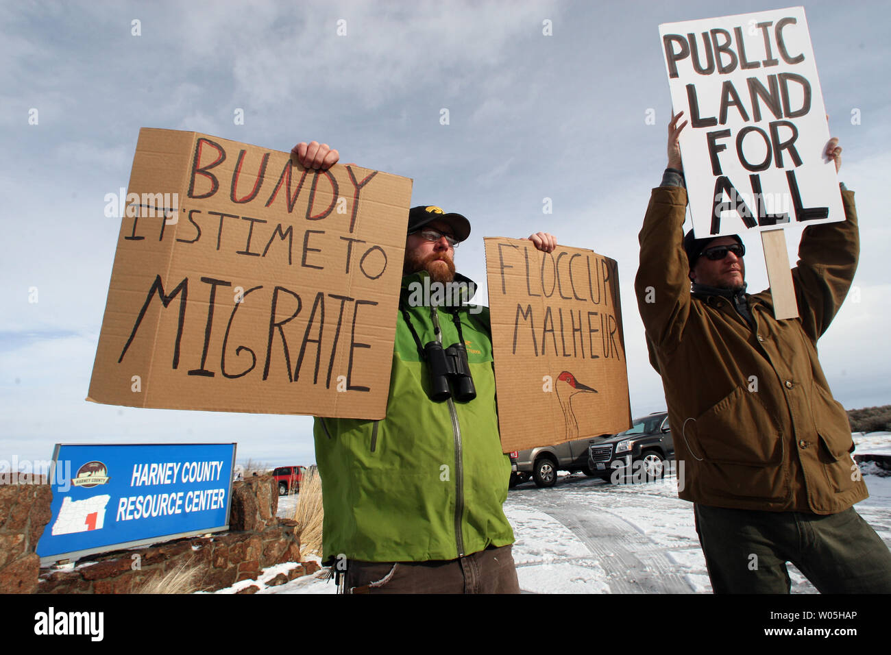 Biologists Cody Martz, left, and Taylor McKinnon hold protest signs at the Malheur National Wildlife Reserve on January 16, 2016 in Burns, Oregon.  Ammon Bundy and about 20 other protesters took over the refuge on Jan. 2 after a rally to support the imprisoned local ranchers Dwight Hammond Jr., and his son, Steven Hammond.      Photo by Jim Bryant/UPI Stock Photo