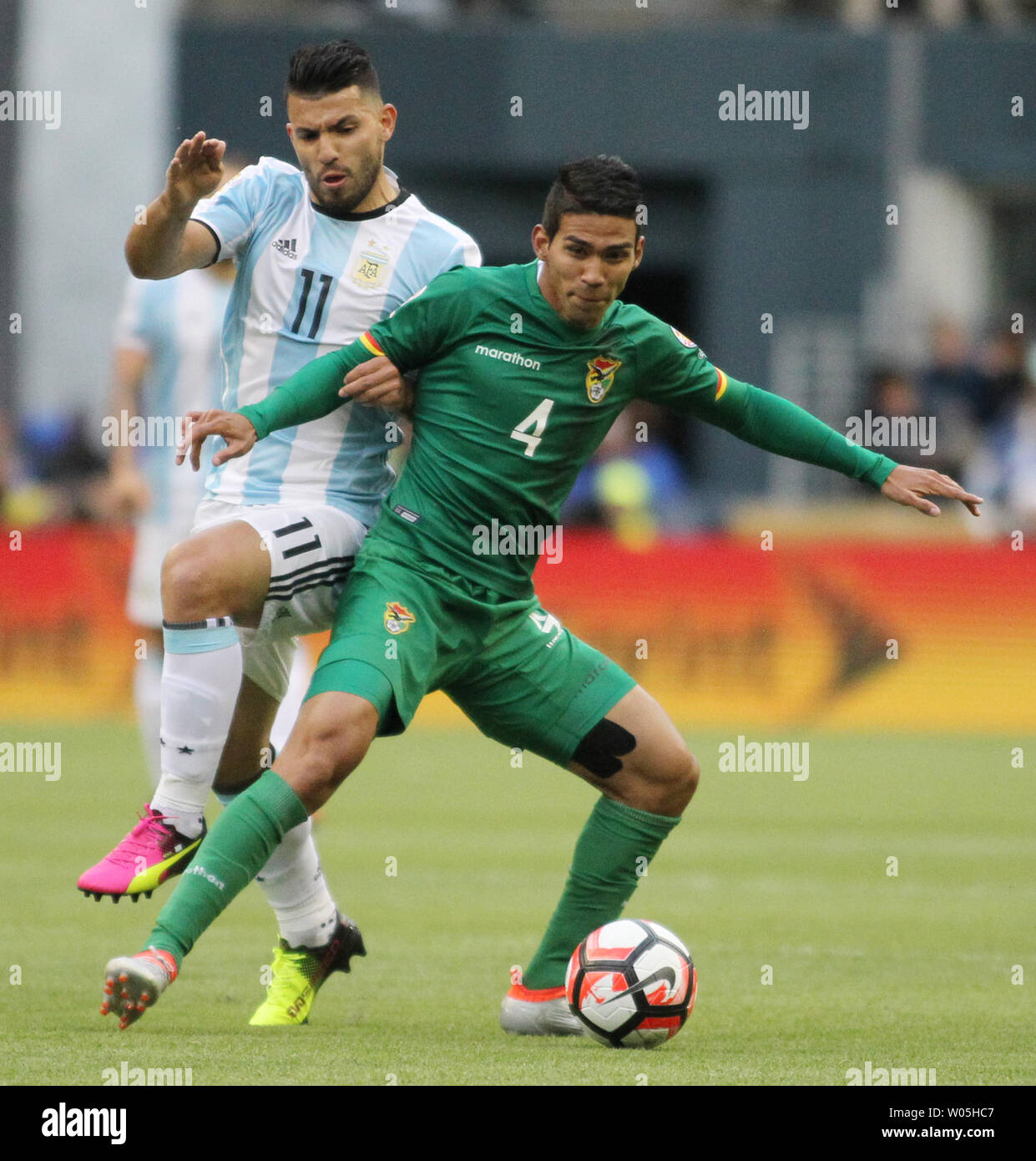 Bolivia's Diego Bejarano (4) takes the ball away from Argentina's Sergio Aguero (11) in a 2016 Copa America Centenario soccer match at CenturyLink Field in Seattle, Washington on June 14, 2016.  Argentina beat Bolivia 3-0.   Photo by Jim Bryant/ UPI Stock Photo
