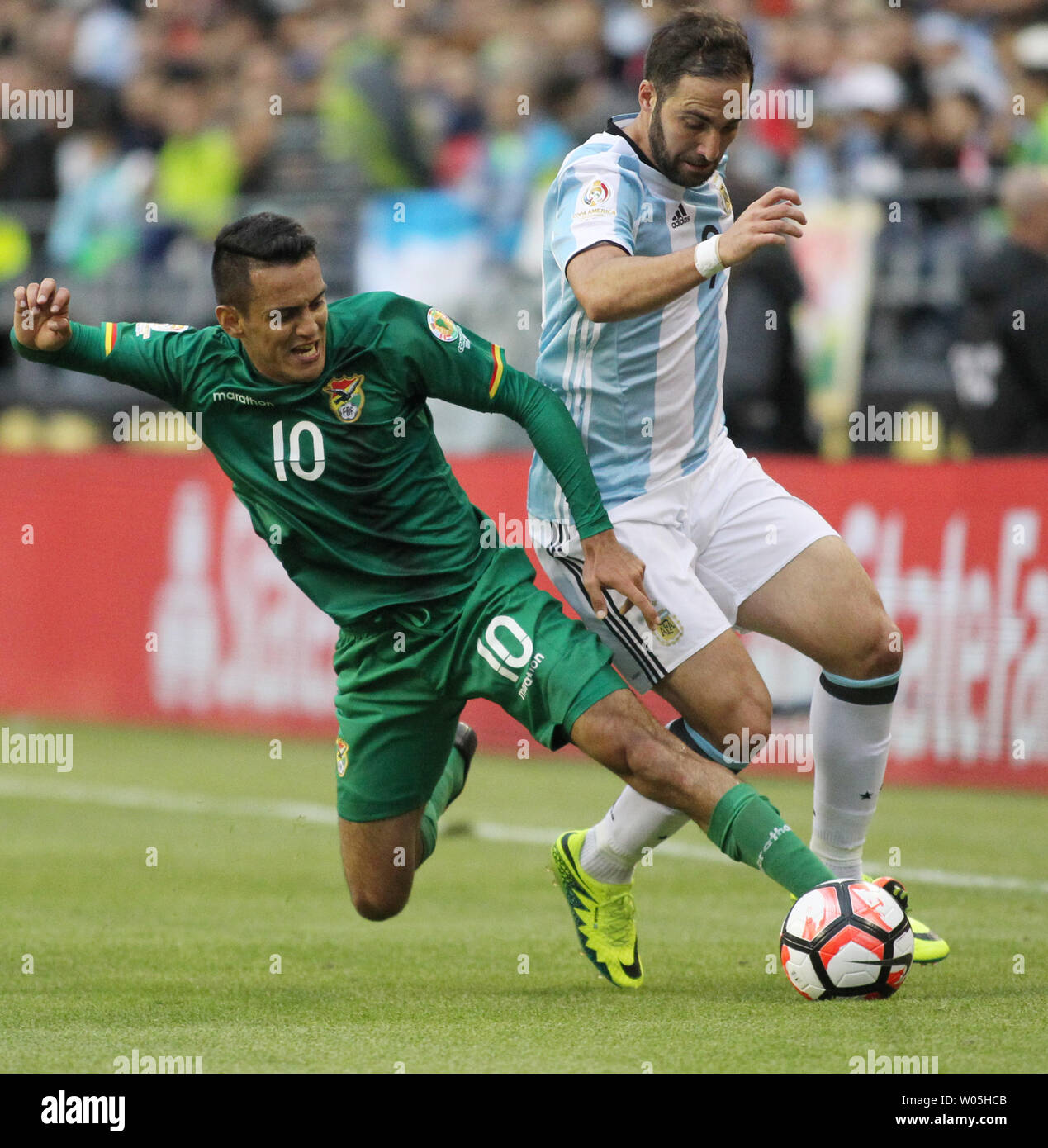 Bolivia's Jhasmani Campos (10) defends against Argentina's Ezequiet Lavezzi (22) in a 2016 Copa America Centenario soccer match at CenturyLink Field in Seattle, Washington on June 14, 2016.  Lavezzi  scored a first half goal in the 3-0 win over Argentina 0.   Photo by Jim Bryant/ UPI Stock Photo