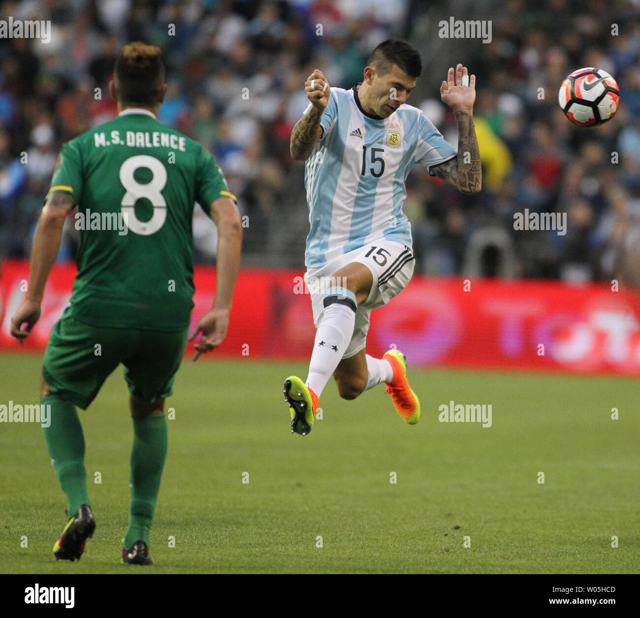 Argentina's Victor Cuesta (15) heads the ball away from Bolivia's Martin Smedberg-Dalence (8) in a 2016 Copa America Centenario soccer match at CenturyLink Field in Seattle, Washington on June 14, 2016.  Argentina beat Bolivia 3-0.   Photo by Jim Bryant/ UPI Stock Photo