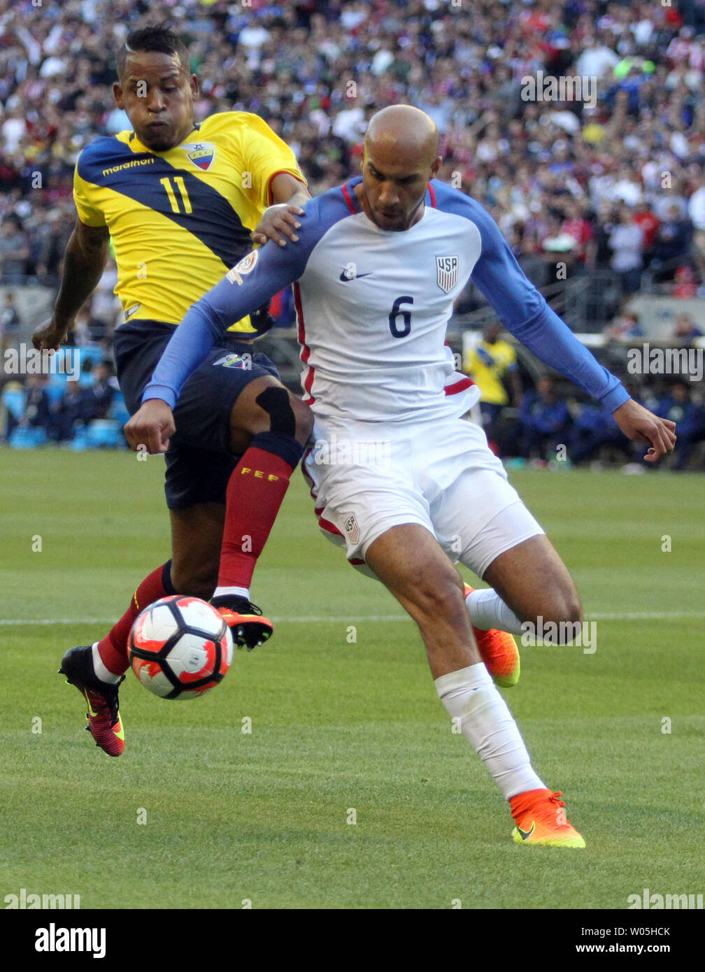 USA's John Brooks (6) is shoved from behind by  Ecuador's Michael Arroyo (11) in a 2016 Copa America Centenario soccer quarterfinals at CenturyLink Field in Seattle, Washington on June 16, 2016.     USA beat Ecuador 2-1 to advance to the semi-finals.    Photo by Jim Bryant/ UPI Stock Photo