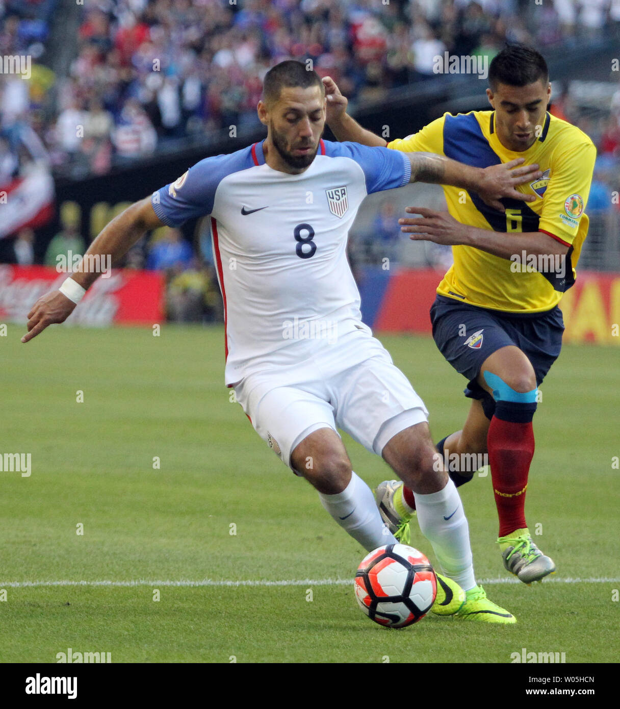USA's Clint Dempsey (8) fends off  Ecuador's Juan Carlos Paredes (5) in a 2016 Copa America Centenario soccer quarterfinals at CenturyLink Field in Seattle, Washington on June 16, 2016.     Dempsey scored a first half goal in the USA 2-1 win over Ecuador to advance to the semi-finals.    Photo by Jim Bryant/ UPI Stock Photo