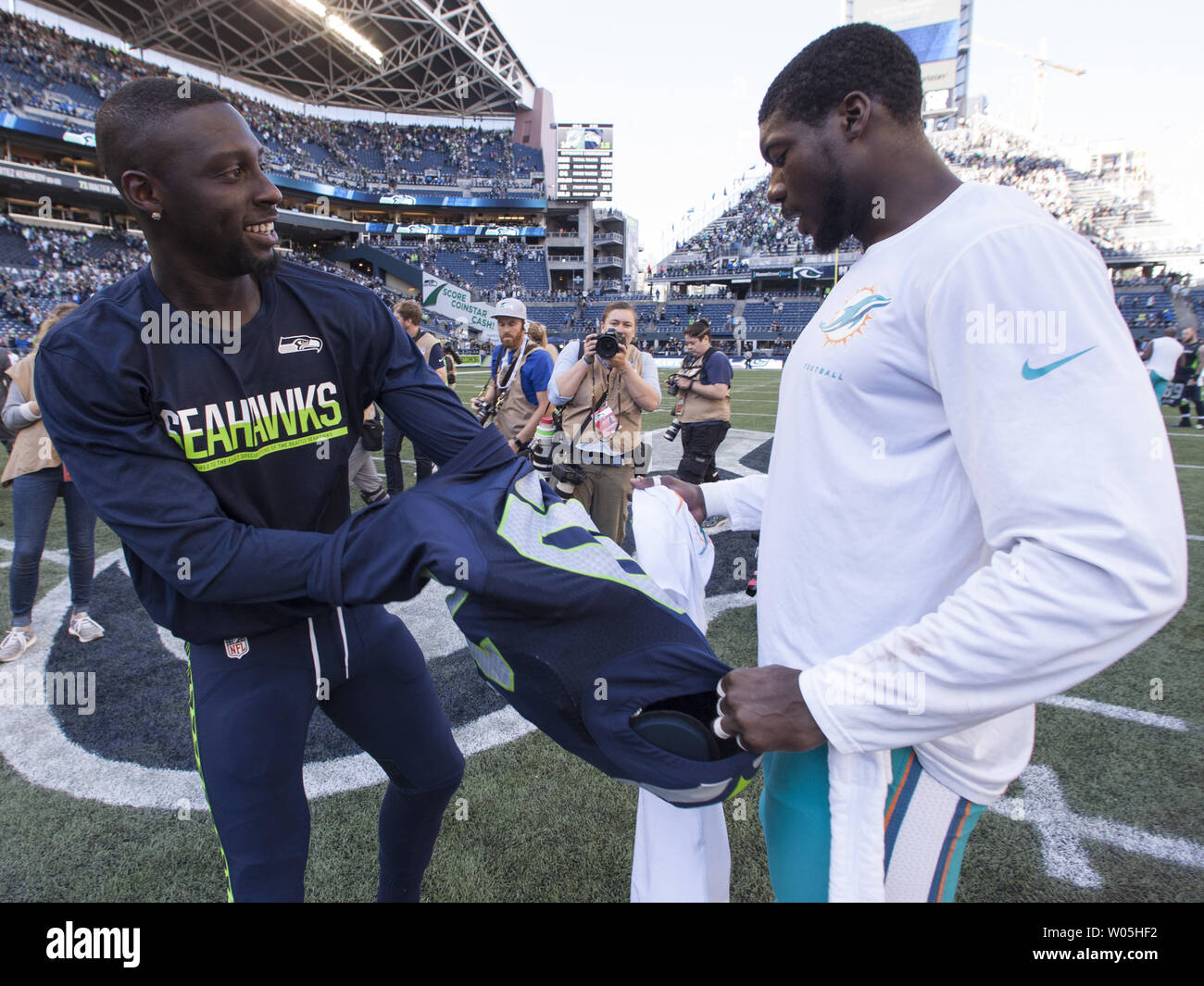 Seattle Seahawks cornerback Jeremy Lane (20) swaps jerseys with former Seahawks teammate Miami Dolphins defensive back Byron Maxwell (41) after the game at CenturyLink Field in Seattle, Washington on September 11, 2016.  Seahawks came from behind to beat the Dolphins 12-10.   Photo by Jim Bryant/UPI Stock Photo