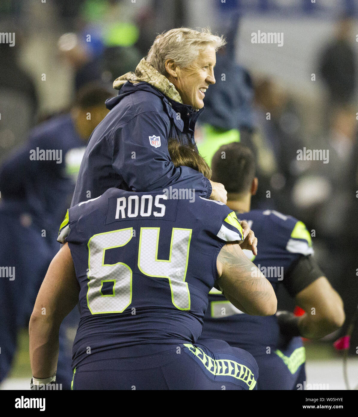 Seattle Seahawks head coach Pete Carroll jokes with offensive guard Jordan  Roos (64) during warm ups before their game against the Atlanta Falcons at  CenturyLink Field in Seattle, Washington on November 20,