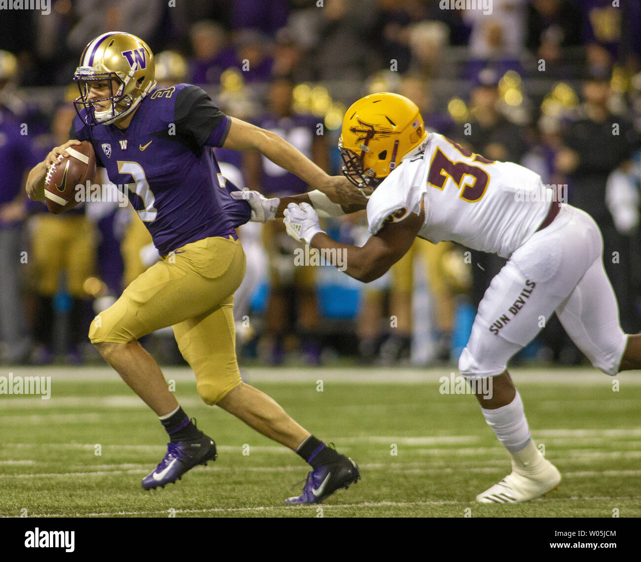 Washington Huskies quarterback Jake Browning (3) tries to escape from Arizona State Sun Devils linebacker Malik Lawal (39) during the second quarter in a PAC-12 College Football game on September 22, 2018 at Husky Stadium Seattle, Washington.  Washington Huskies beat the Arizona Sun Devils  27-20.    Photo by Jim Bryant/UPI Stock Photo