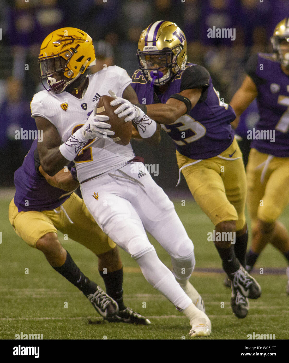 Arizona State Sun Devils wide receiver Brandon Aiyuk (2) tries to break away  from Washington Huskies defensive back Jordan Miller (23) during the second  quarter in a PAC-12 College Football game on