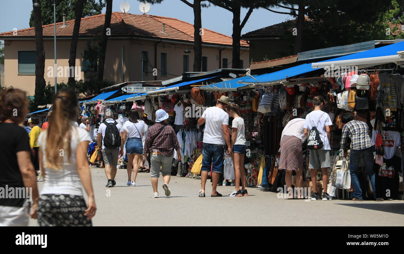 Pisa, Tuscany, Italy. 06/21/2019. Tourist market in the city of Pisa. In the stalls, holiday maker buy souvenirs that recall Piazza dei Miracoli and T Stock Photo