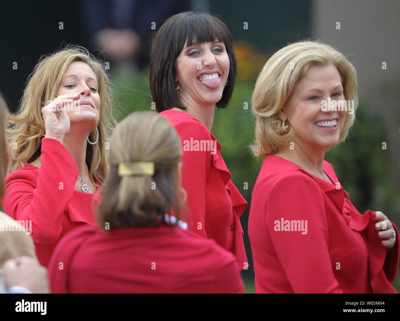 United States team members wives Tabitha Furyk (L), Lisa Cink (C) and Janice Haas attend the opening ceremony of The Presidents Cup at Harding Park Golf Course in San Francisco, California on October 7, 2009. Seated behind Bush are members of the United States team.   UPI/Kevin Dietsch Stock Photo