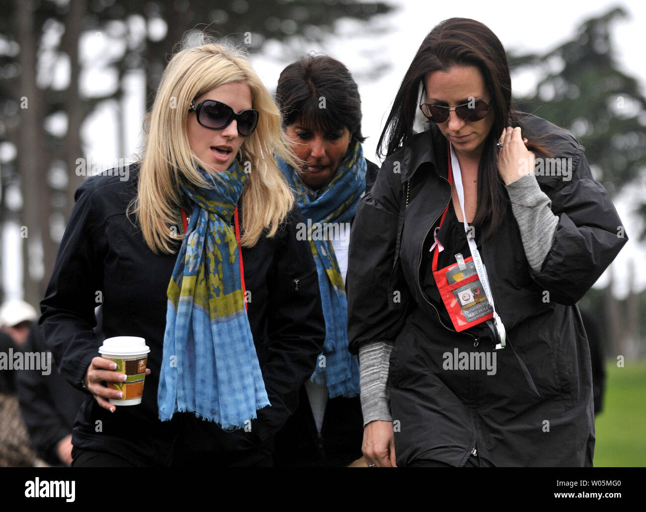 Candice Clark (L), the wife of International team member Tim Clark, walks with other wives during the during the fourth round of The Presidents Cup at Harding Park Golf Course in San Francisco, California on October 10, 2009.    UPI/Kevin Dietsch Stock Photo