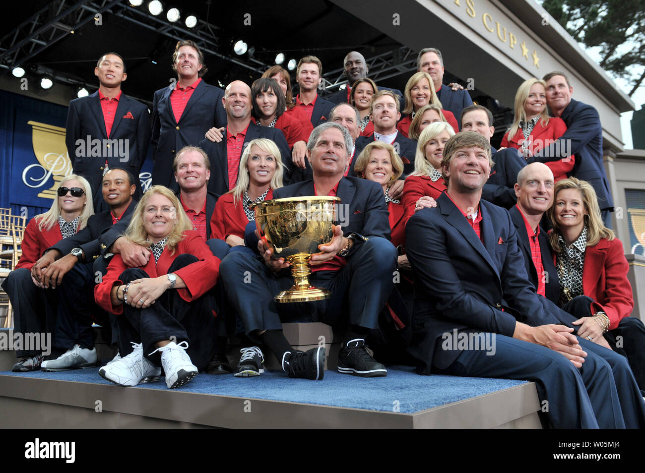 The United States team accompanied by their wives pose for a team photo after winning the Presidents Cup at Harding Park Golf Course in San Francisco, California on October 11, 2009.    UPI/Kevin Dietsch Stock Photo