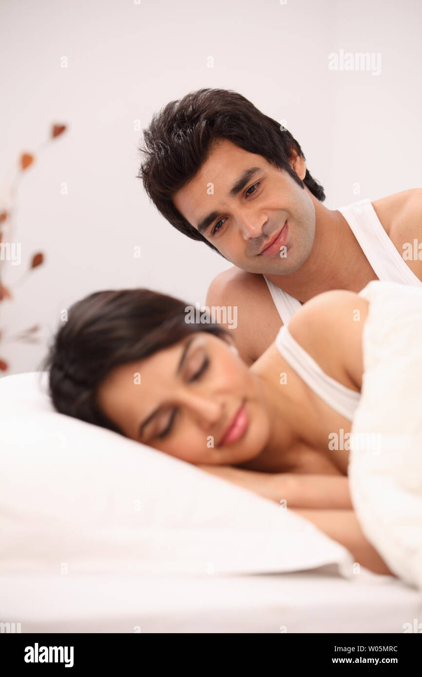 Indian couple in the bed Stock Photo