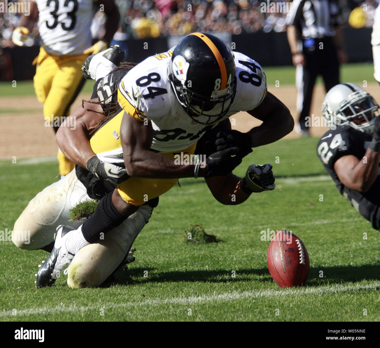 Pittsburgh Steelers WR Antonio Brown (84) is tackled by Oakland Raiders LB Philip Wheeler (52) on the 1 yd line before recovering his own fumble for a touchdown during the third quarter  at O.co Coliseum in Oakland, California on September 23, 2012.       UPI/Bruce Gordon Stock Photo